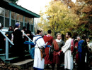 Gathering at the Back Steps of the Inn